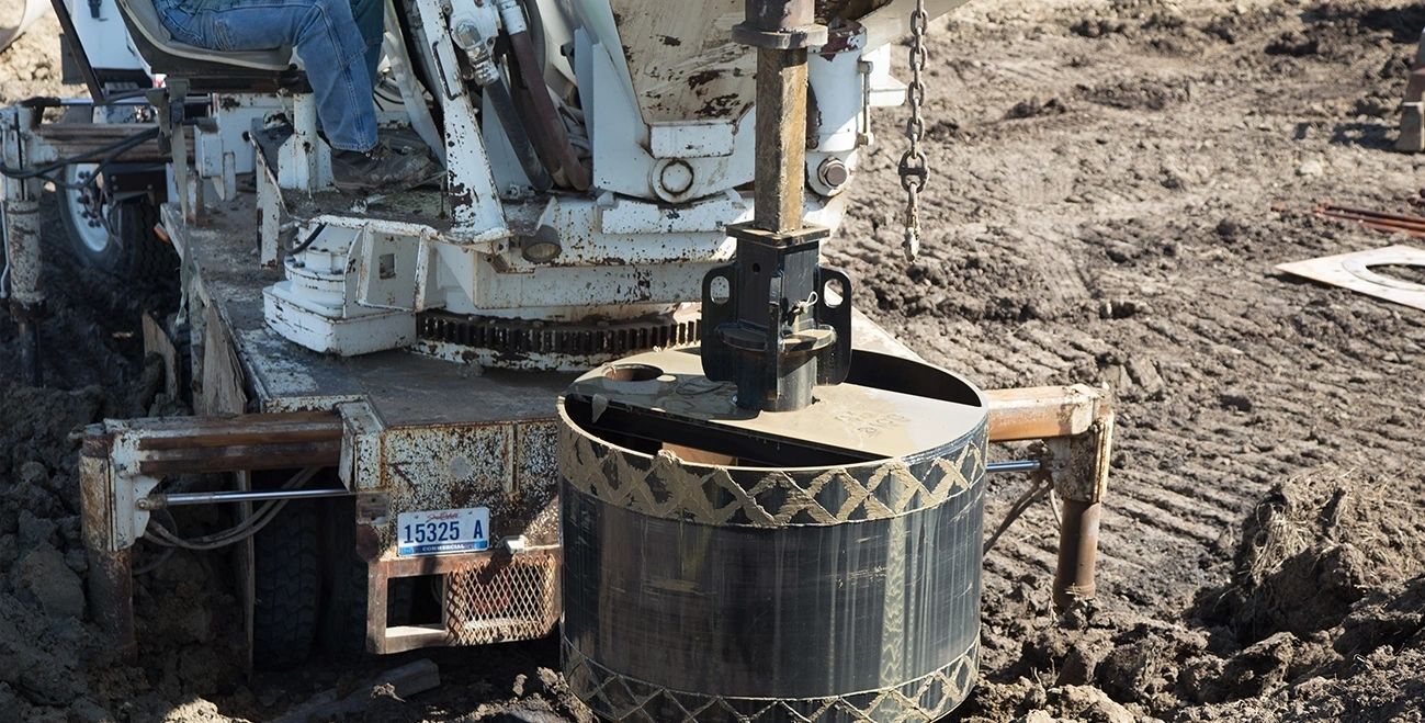Digger derrick boring a Sioux Falls foundation drilling hole